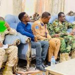 Muxuu yahay Sarkaalka “Camerada” iska qariyey xili shir Amni socday.